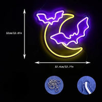 Letreros de neón con forma de murciélago y Luna.