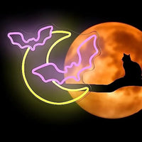 Letreros de neón con forma de murciélago y Luna.